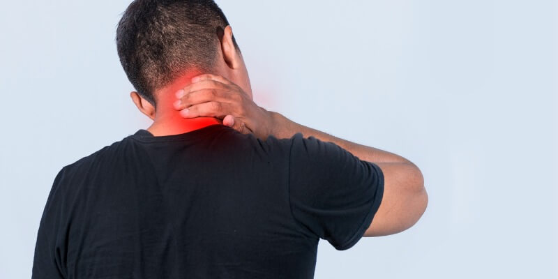 Physiotherapist assessing a patient with neck pain in Zirakpur